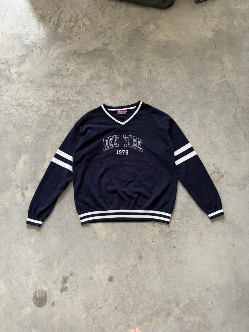 Edikted Navy and White V‑Neck Sweater with 'New York 1976'